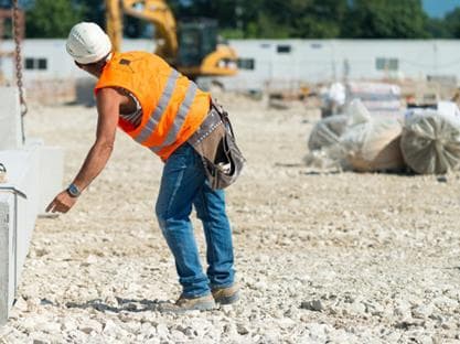 Construction worker carrying out work at a site